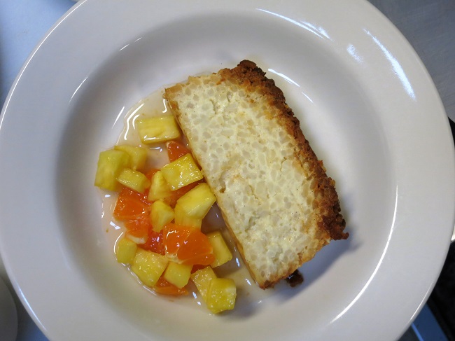 Carmelized rice terrine served with tropical fruits and rum syrup.