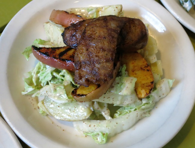 House smoked pork sausage on a salad of Napa cabbage, grilled apples, gruyere cheese, yellow potatoes and cider-grain mustard vinaigrette