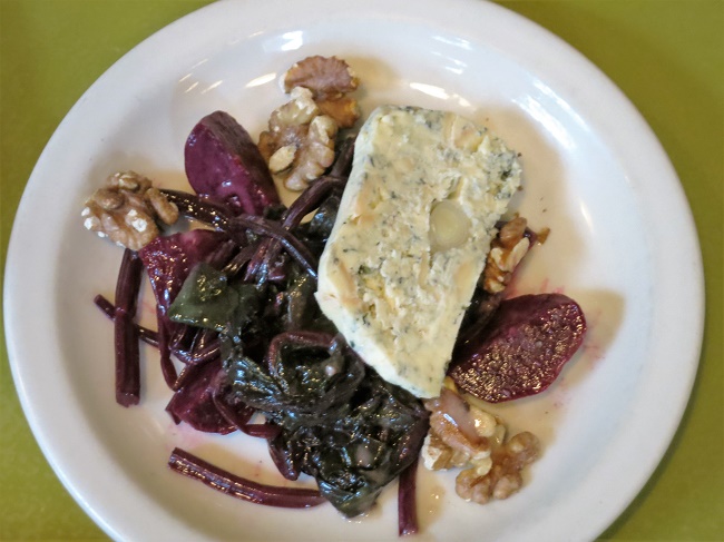 Bleu cheese and leek terrine served on marinated beets and beet greens and toasted walnuts